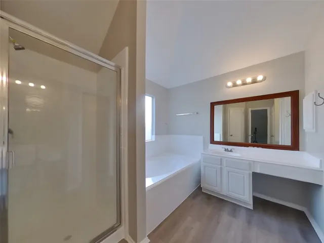 a bathroom with a bathtub and a sink