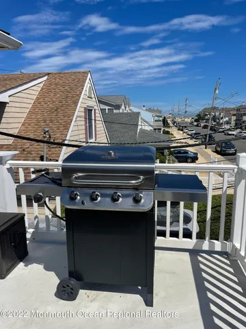 a view of a patio with table and chairs