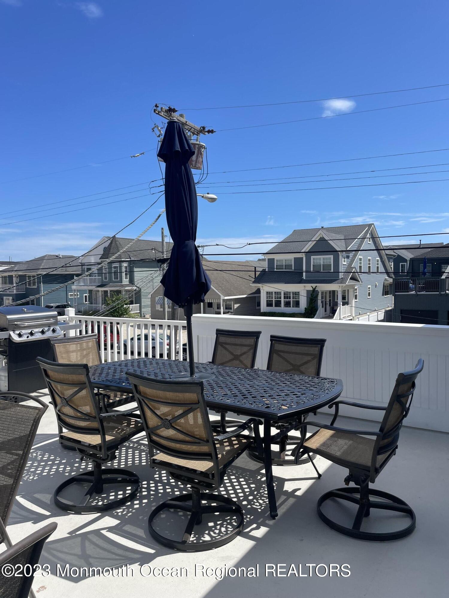 65 Grand Central Avenue Lavallette, NJ 08735 - Photo 9 of 15 a view of a chairs and table in patio