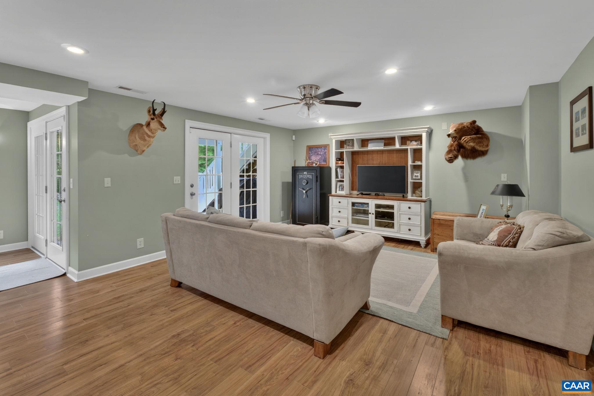 511 Taylor Ridge Way Palmyra, VA 22963 - Photo 37 of 57 a living room with furniture and a flat screen tv