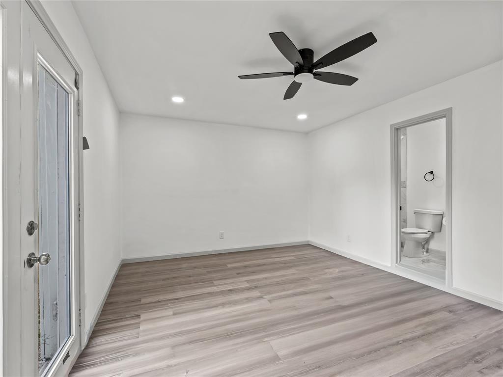 326 Bluebonnet Trail Garland, TX 75043 - Photo 13 of 25 Primary bedroom with private entrance into the backyard!