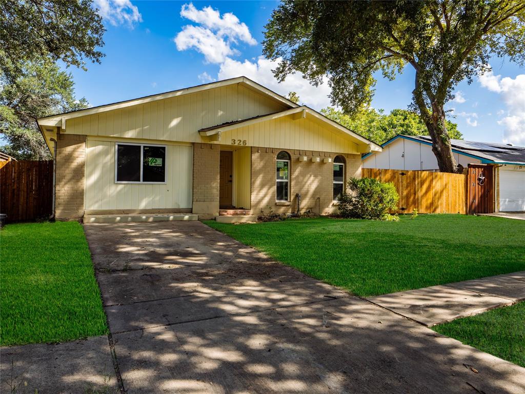 326 Bluebonnet Trail Garland, TX 75043 - Photo 22 of 25 Virtually staged yard to show potential—new sod negoitable for buyer at closing.