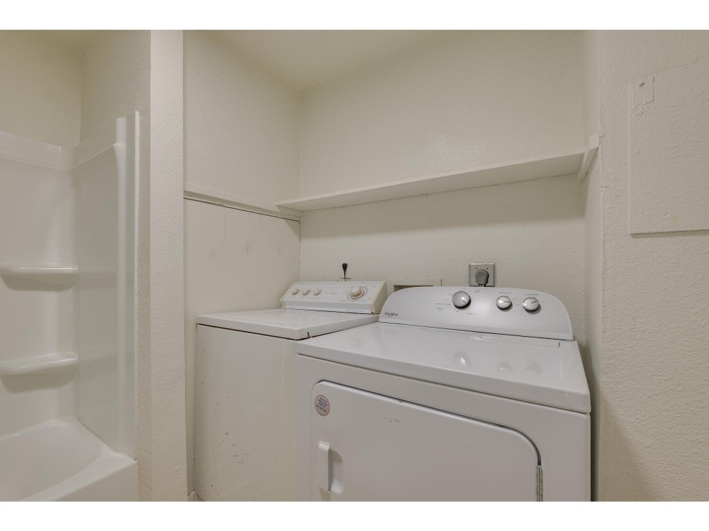 106 South Ave A, Unit A Elgin, TX 78621 - Photo 9 of 12 a utility room with dryer and washer