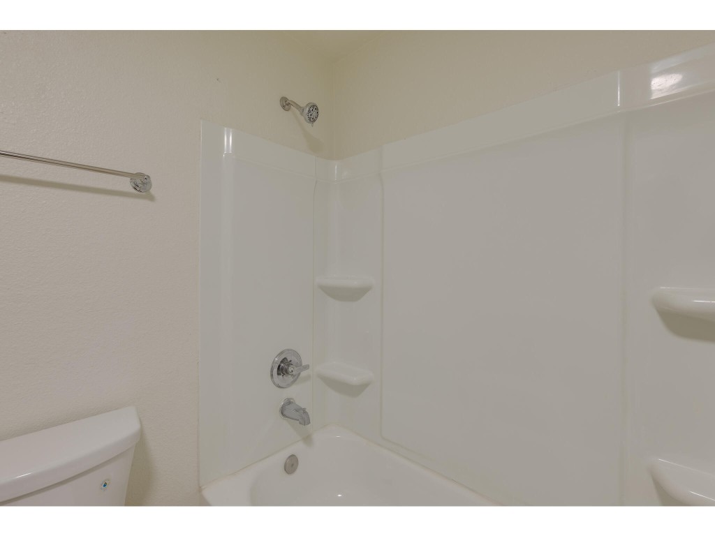 106 South Ave A, Unit A Elgin, TX 78621 - Photo 10 of 12 a bathroom with a shower