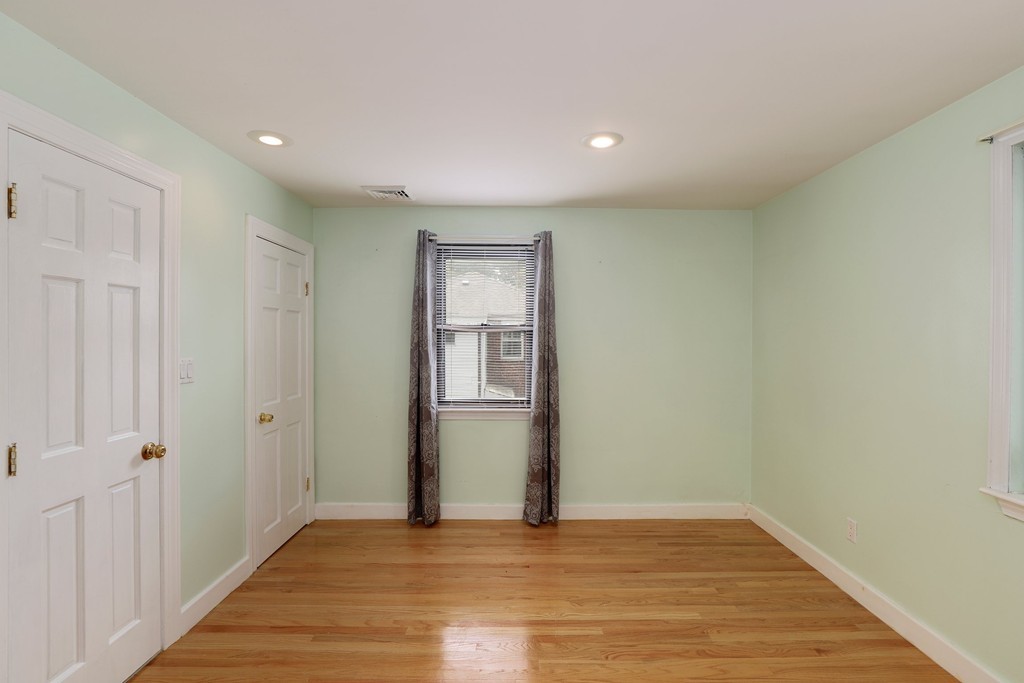 37 Louise Road, Unit 37 Newton, MA 02467 - Photo 21 of 33 a view of an empty room with wooden floor
