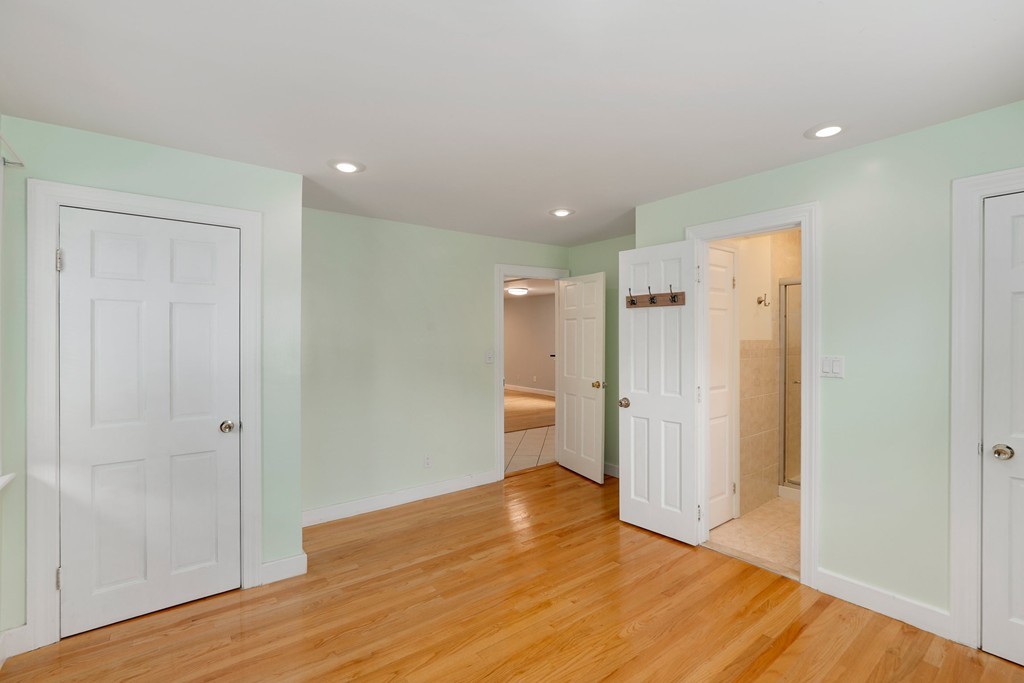 37 Louise Road, Unit 37 Newton, MA 02467 - Photo 23 of 33 a view of empty room with wooden floor