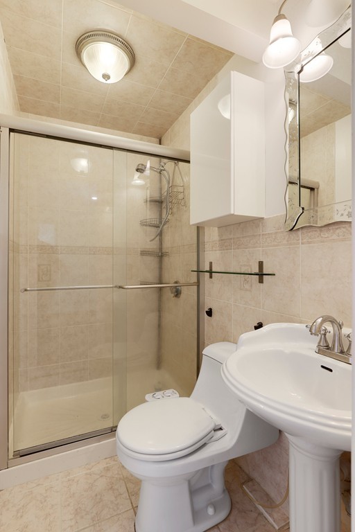 37 Louise Road, Unit 37 Newton, MA 02467 - Photo 25 of 33 a bathroom with a sink toilet and shower
