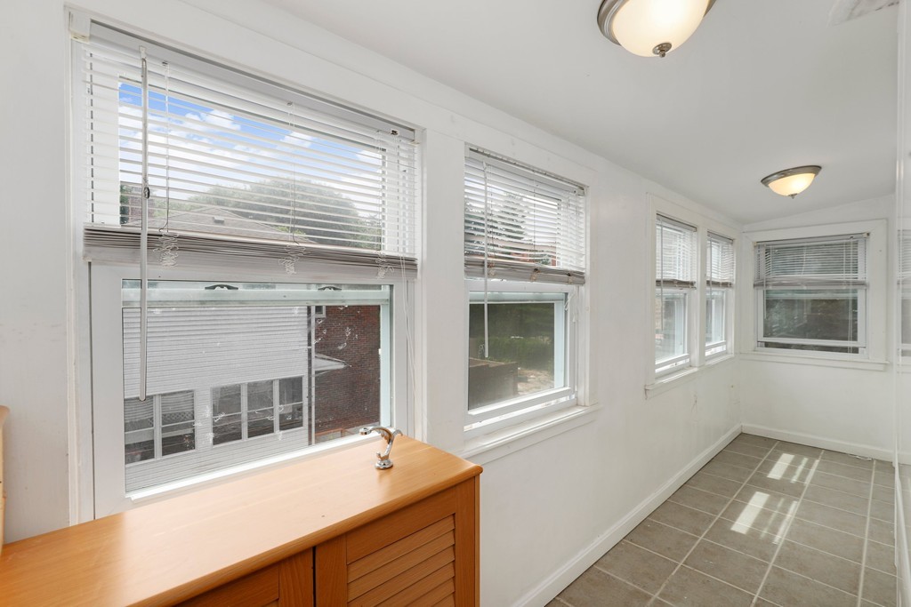 37 Louise Road, Unit 37 Newton, MA 02467 - Photo 27 of 33 a view of a house with a barbeque and large windows