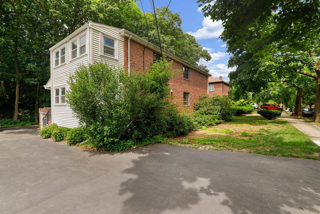 37 Louise Road, Unit 37 Newton, MA 02467 - Photo 3 of 33 a front view of a house with garden