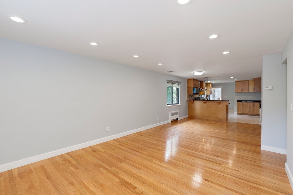 37 Louise Road, Unit 37 Newton, MA 02467 - Photo 6 of 33 a view of empty room with wooden floor
