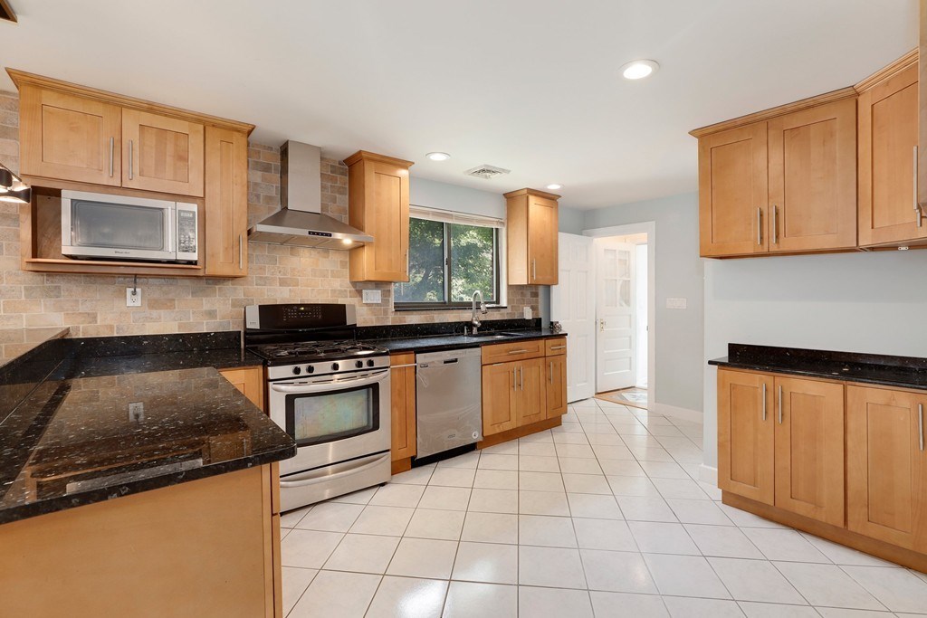 37 Louise Road, Unit 37 Newton, MA 02467 - Photo 8 of 33 a kitchen with a stove a sink and a microwave