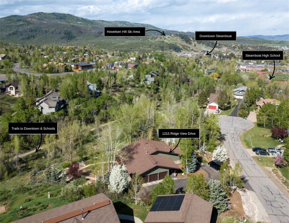 1215 Ridge View Drive Steamboat Springs, CO 80487 - Photo 20 of 30 Aerial view of property's location with a mountain backdrop and nearby suburban area
