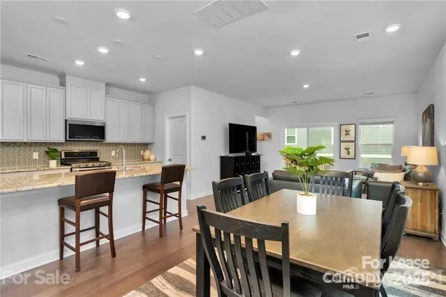 a view of kitchen with dining table and chairs