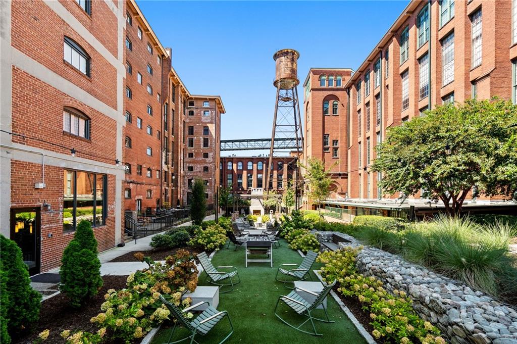 a front view of a building with garden