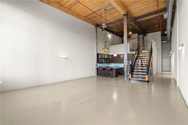 a view of an empty room with a fireplace