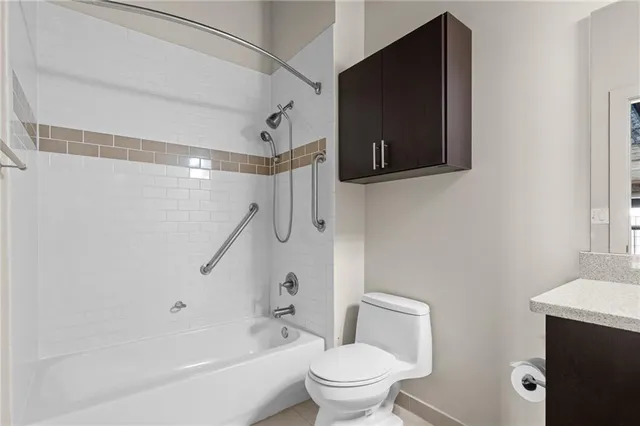 a bathroom with a toilet and a bathtub