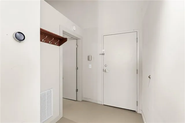 a view of a hallway with a potted plant