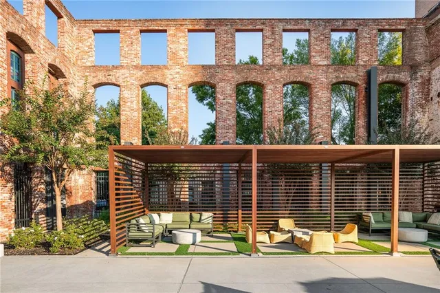 front view of a brick building with a street