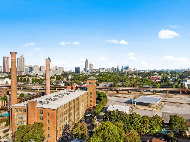 a front view of a building with glass windows and a table