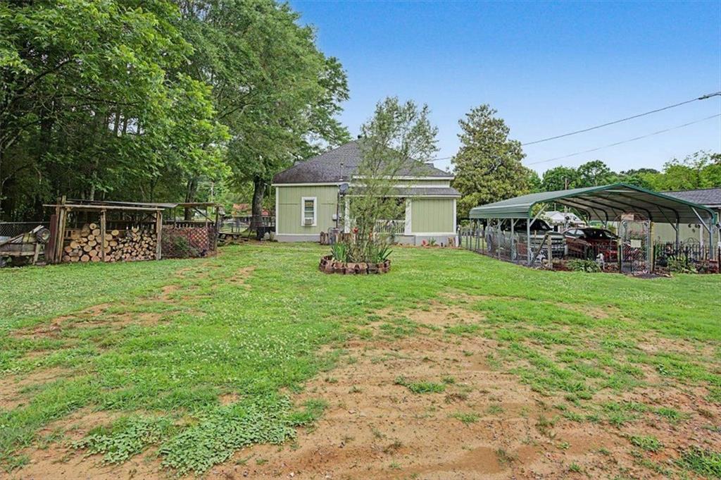 483 Coal Road Northwest Resaca, GA 30735 - Photo 50 of 56 a view of a house with a backyard porch and sitting area