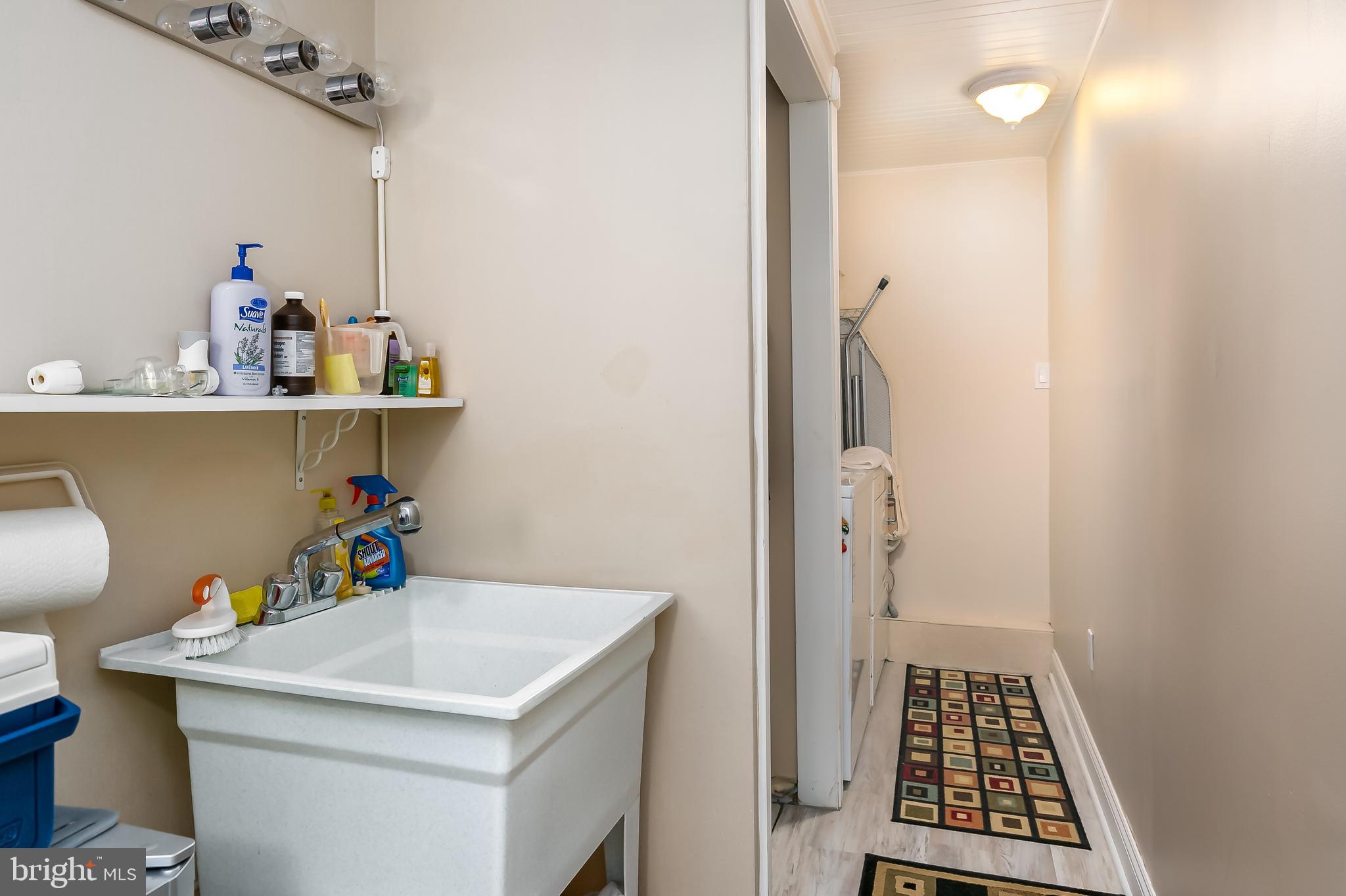 1201 Fulwood Road Cherry Hill, NJ 08034 - Photo 21 of 24 laundry room with closet , sink and shelving