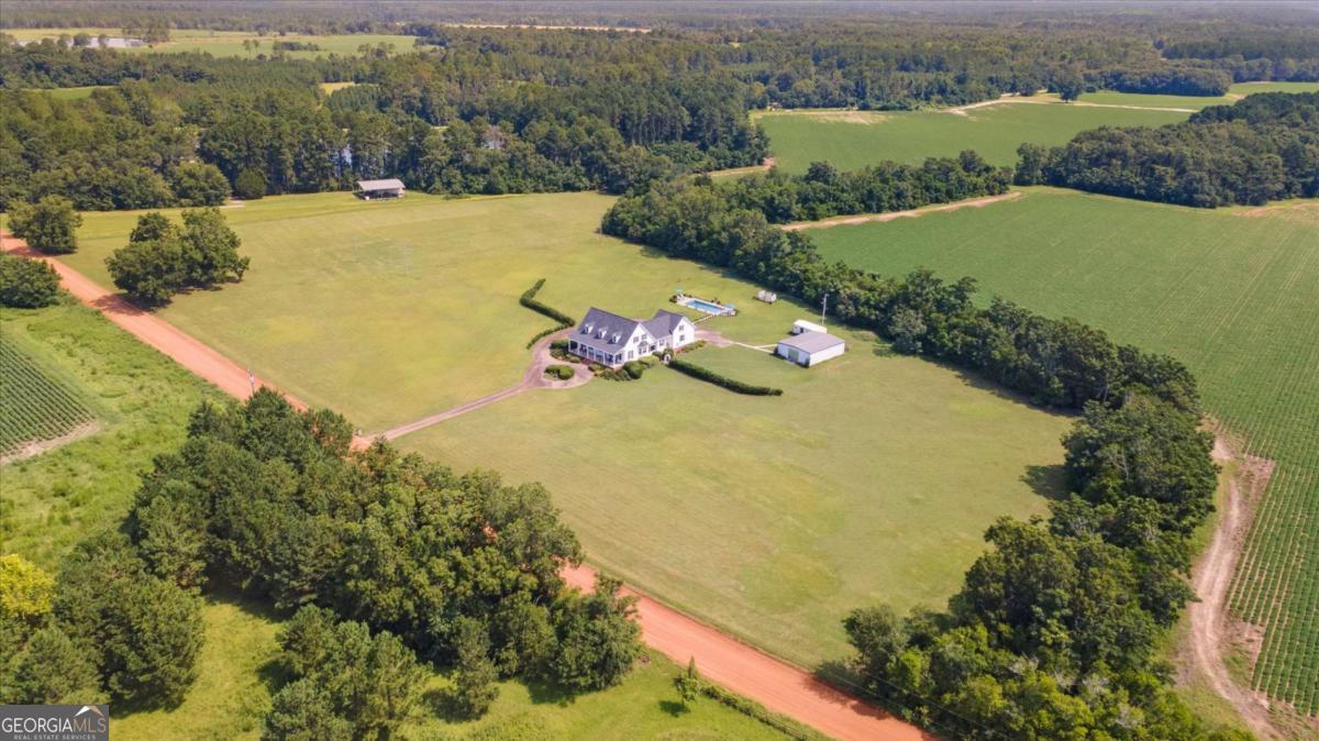 1557 Ellis Road Register, GA 30452 - Photo 1 of 1 an aerial view of a house with a yard