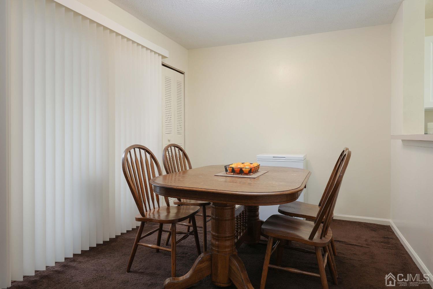 1026 Edpas Road New Brunswick, NJ 08901 - Photo 8 of 20 a view of a room with a table and chairs