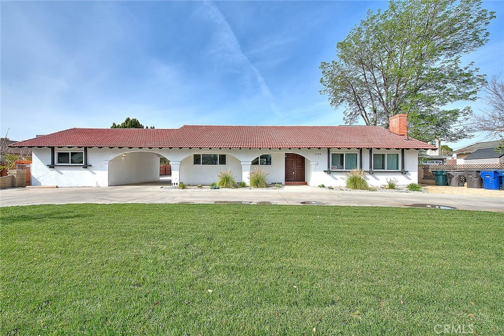 5759 Grand Avenue Riverside, CA 92504 - Photo 1 of 1 a front view of a house with a garden