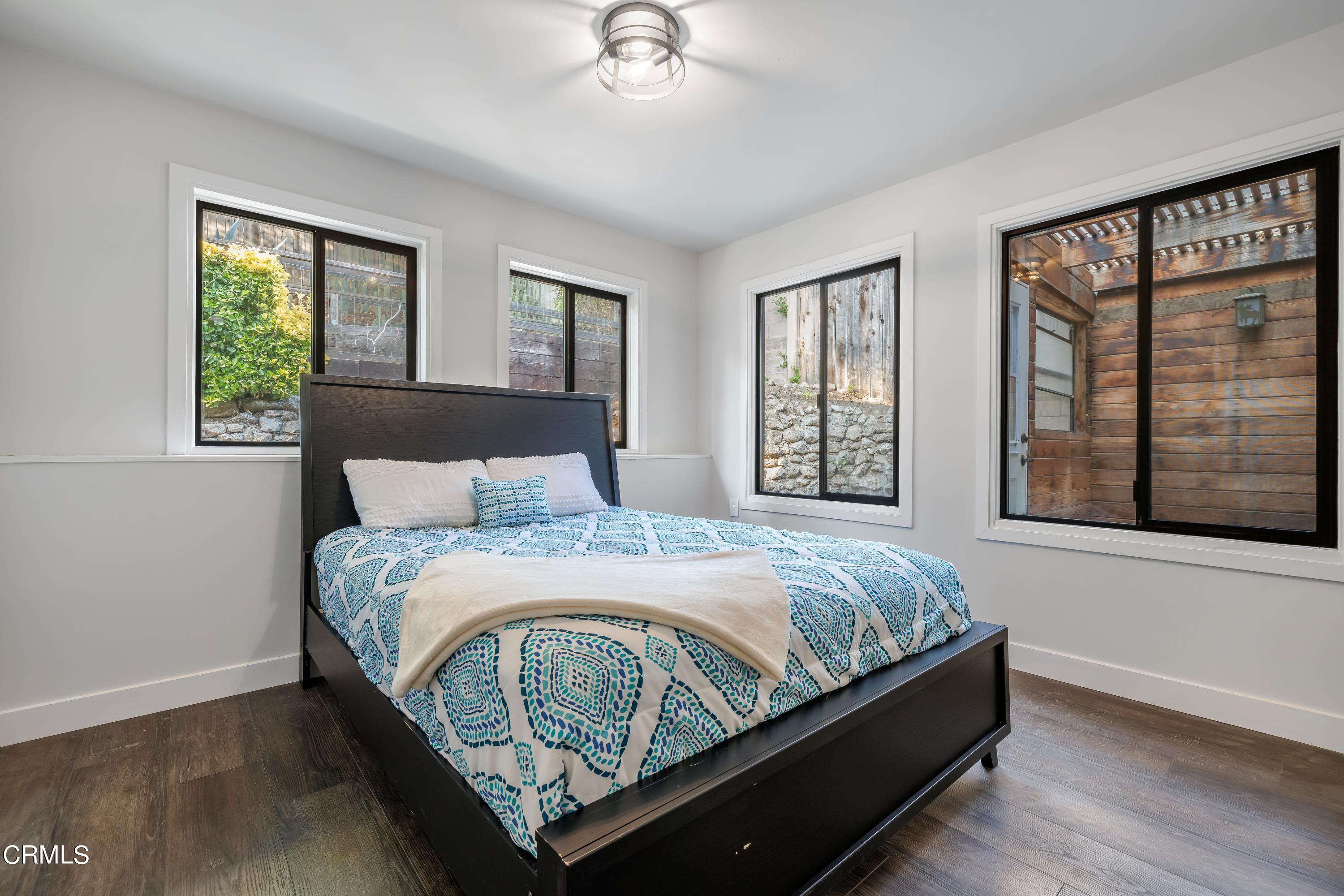 6463 Tokay Road Tujunga, CA 91042 - Photo 13 of 23 a bed sitting in a bedroom next to a window