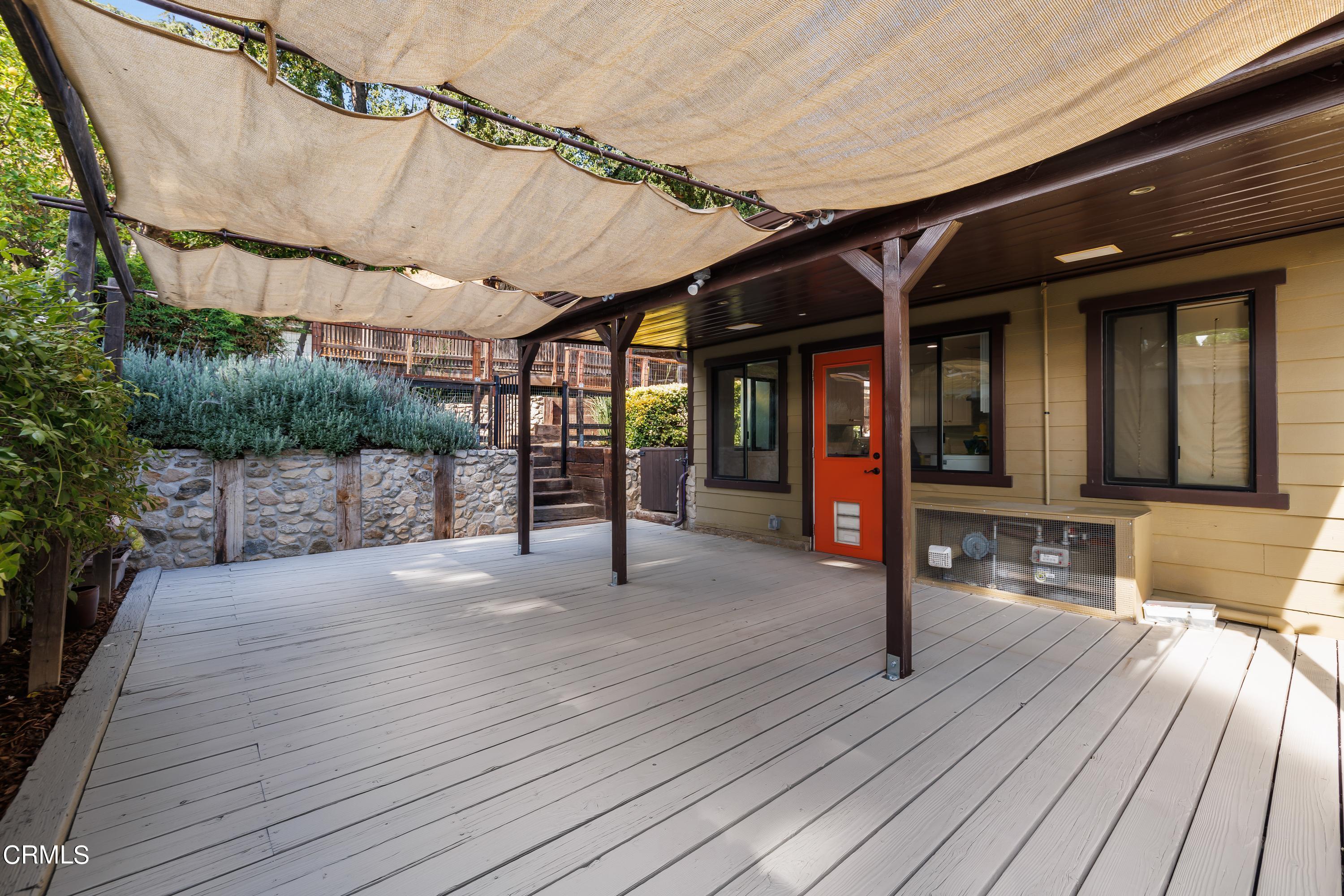 6463 Tokay Road Tujunga, CA 91042 - Photo 18 of 23 a view of a patio with table and chairs with wooden floor