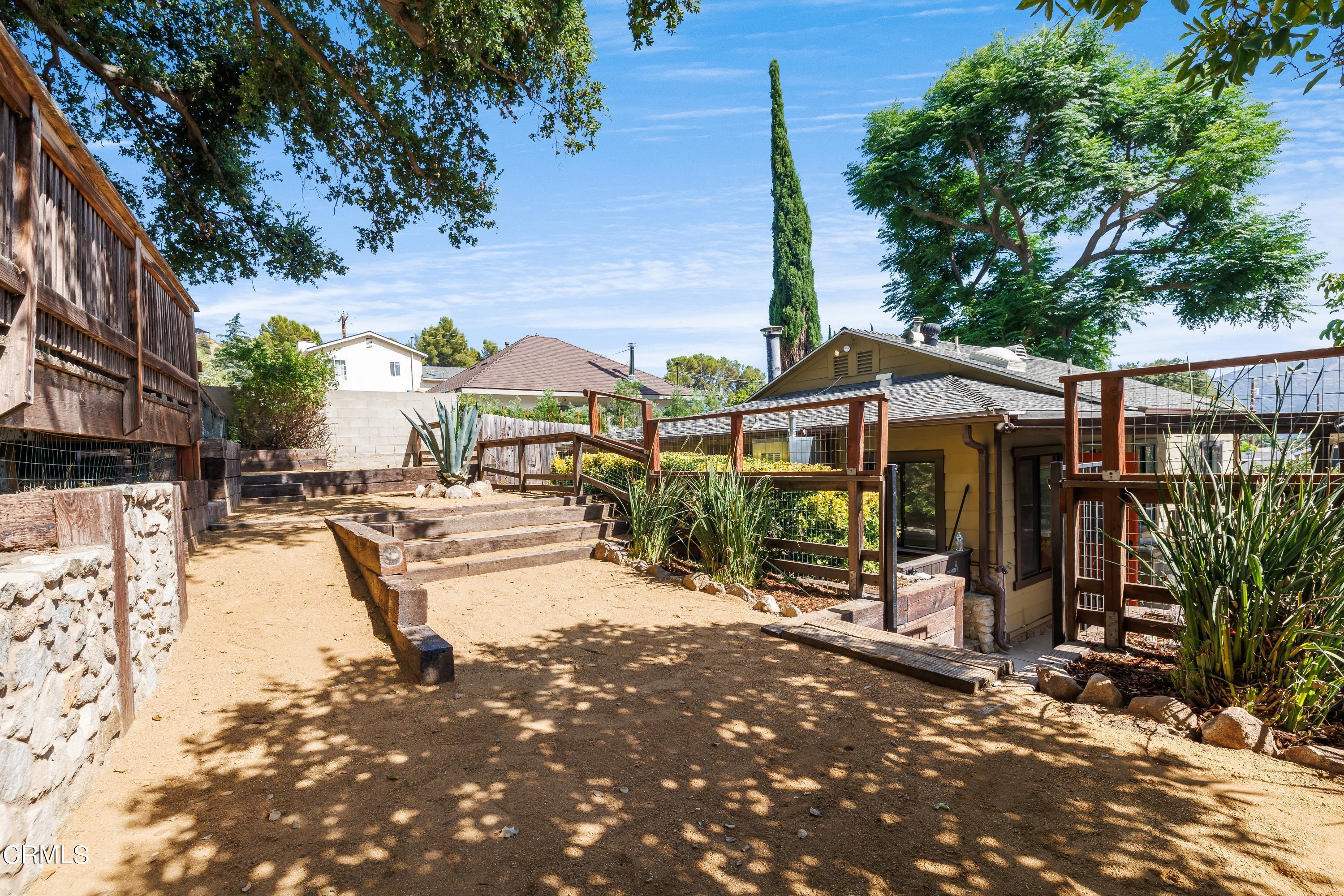 6463 Tokay Road Tujunga, CA 91042 - Photo 19 of 23 an outdoor view of a house with swimming pool