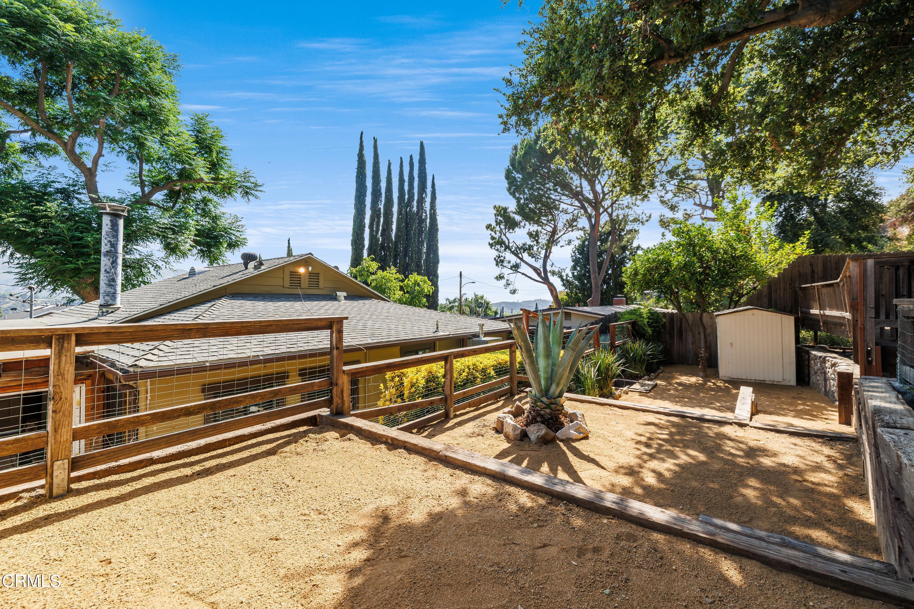 6463 Tokay Road Tujunga, CA 91042 - Photo 20 of 23 a view of backyard with chairs and wooden fence
