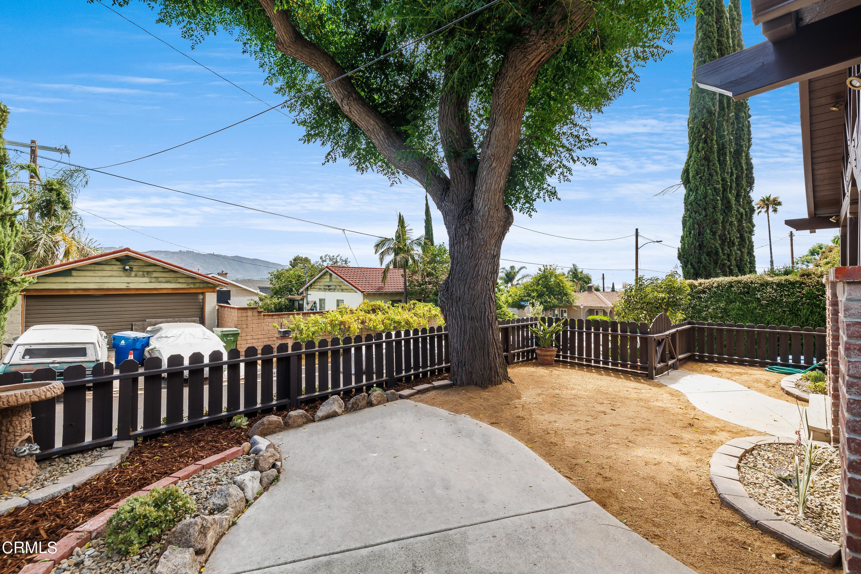 6463 Tokay Road Tujunga, CA 91042 - Photo 6 of 23 a view of a wrought iron fences in front of house