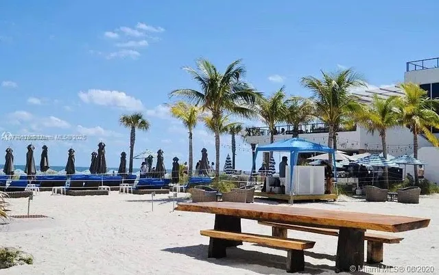 a view of swimming pool with outdoor seating
