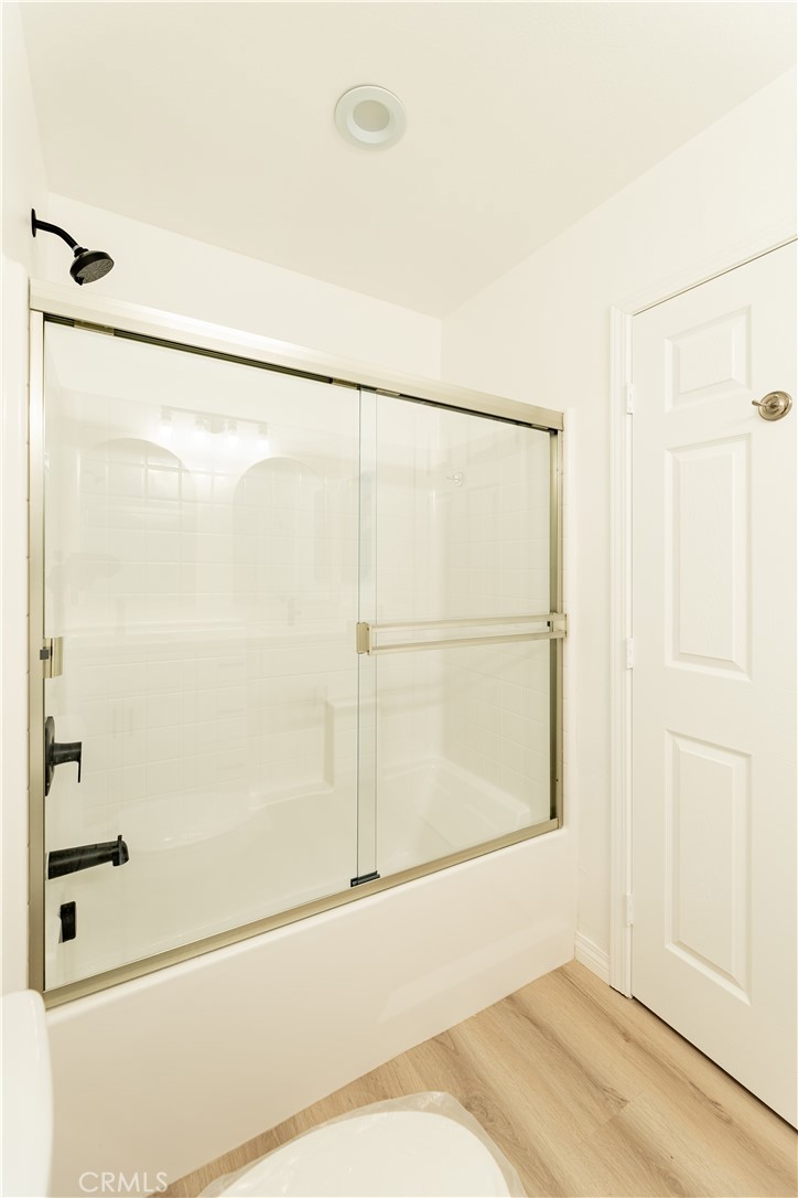 16925 Nanticoke Road Apple Valley, CA 92307 - Photo 37 of 87 a bathroom with a shower and a glass door