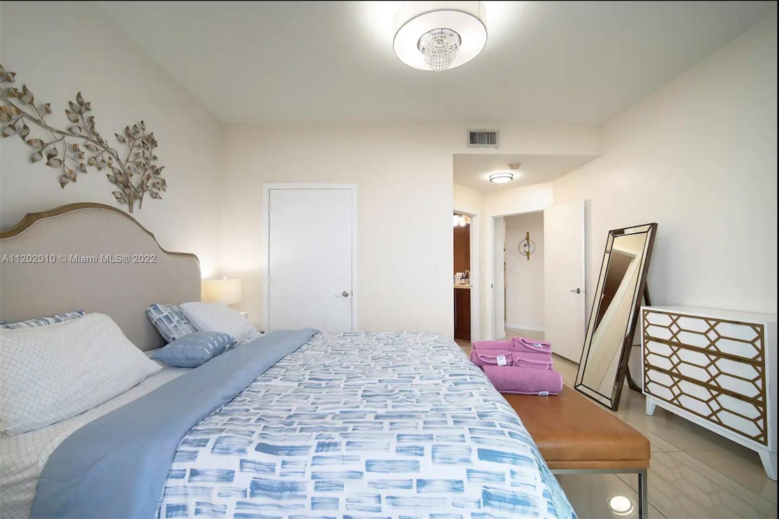 Brickell Miami, FL 33130 - Photo 14 of 30 a large bedroom with a bed and wooden floor