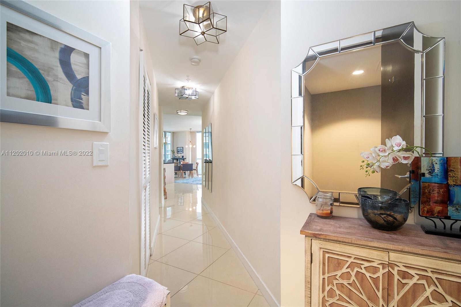 Brickell Miami, FL 33130 - Photo 2 of 30 a bathroom with a sink a mirror and a shower