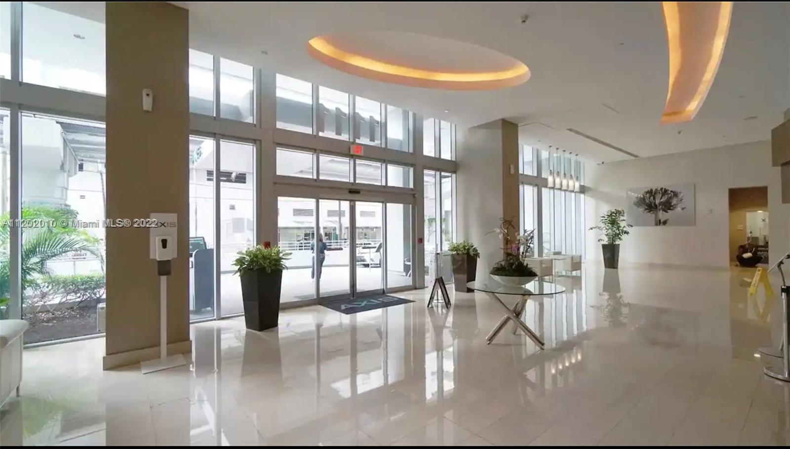 Brickell Miami, FL 33130 - Photo 26 of 30 a living room with furniture and a floor to ceiling window