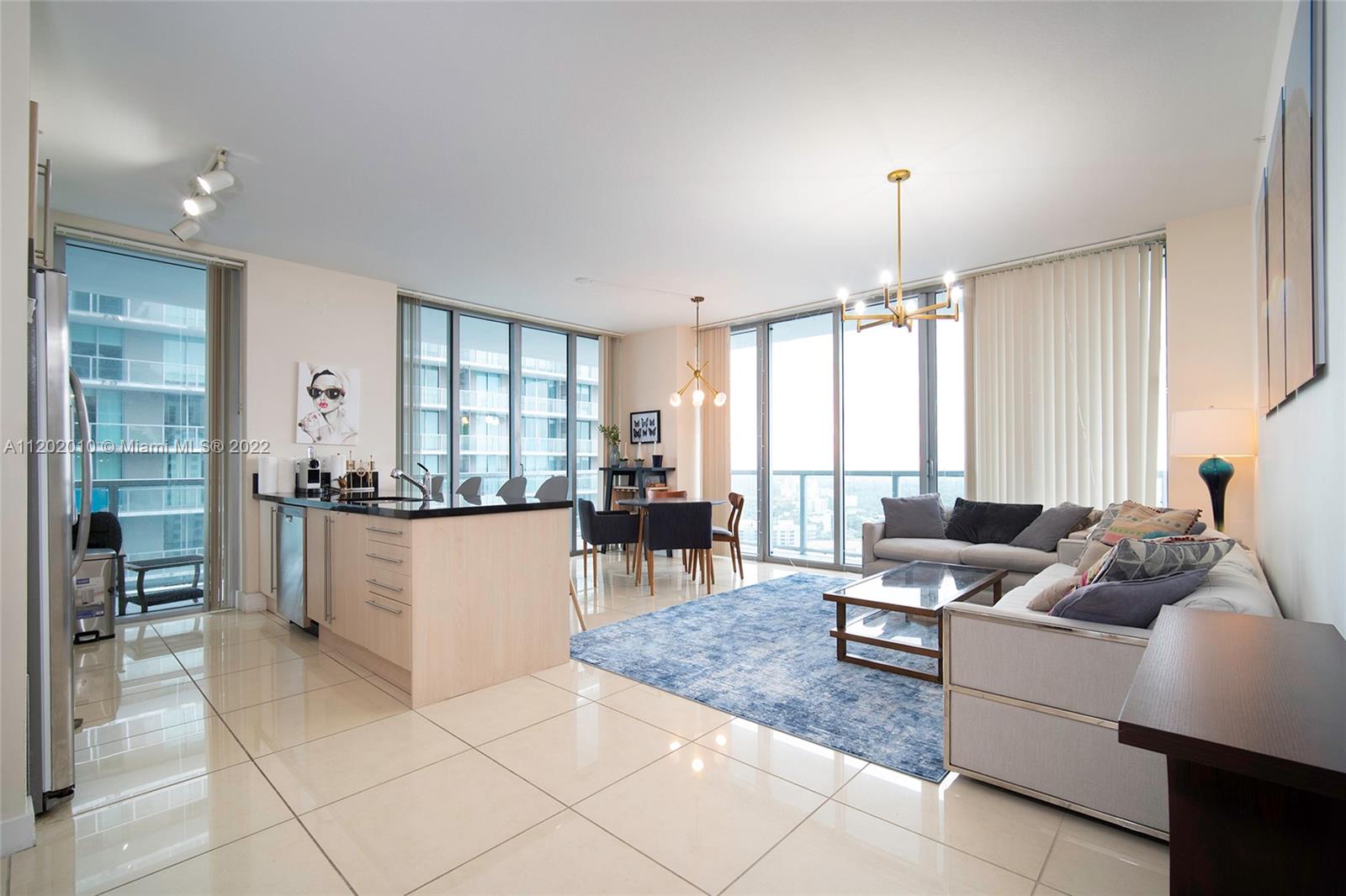 Brickell Miami, FL 33130 - Photo 4 of 30 a living room with furniture and a large window