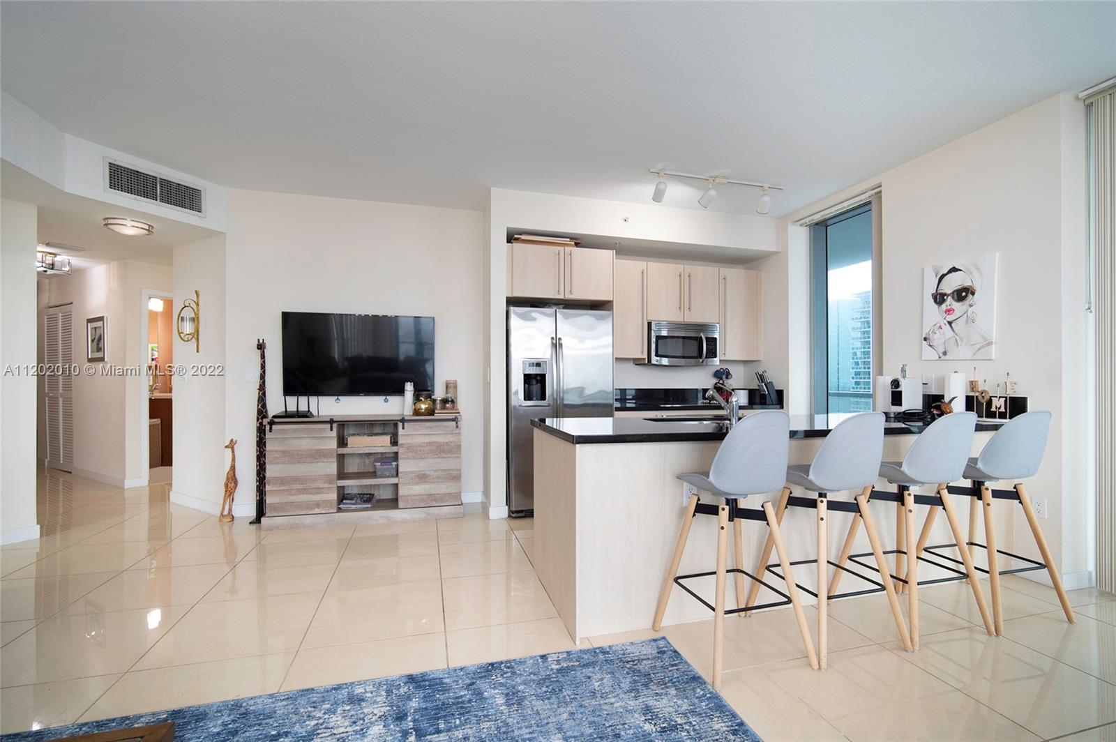 Brickell Miami, FL 33130 - Photo 5 of 30 a view of kitchen with counter top space cabinets and refrigerator