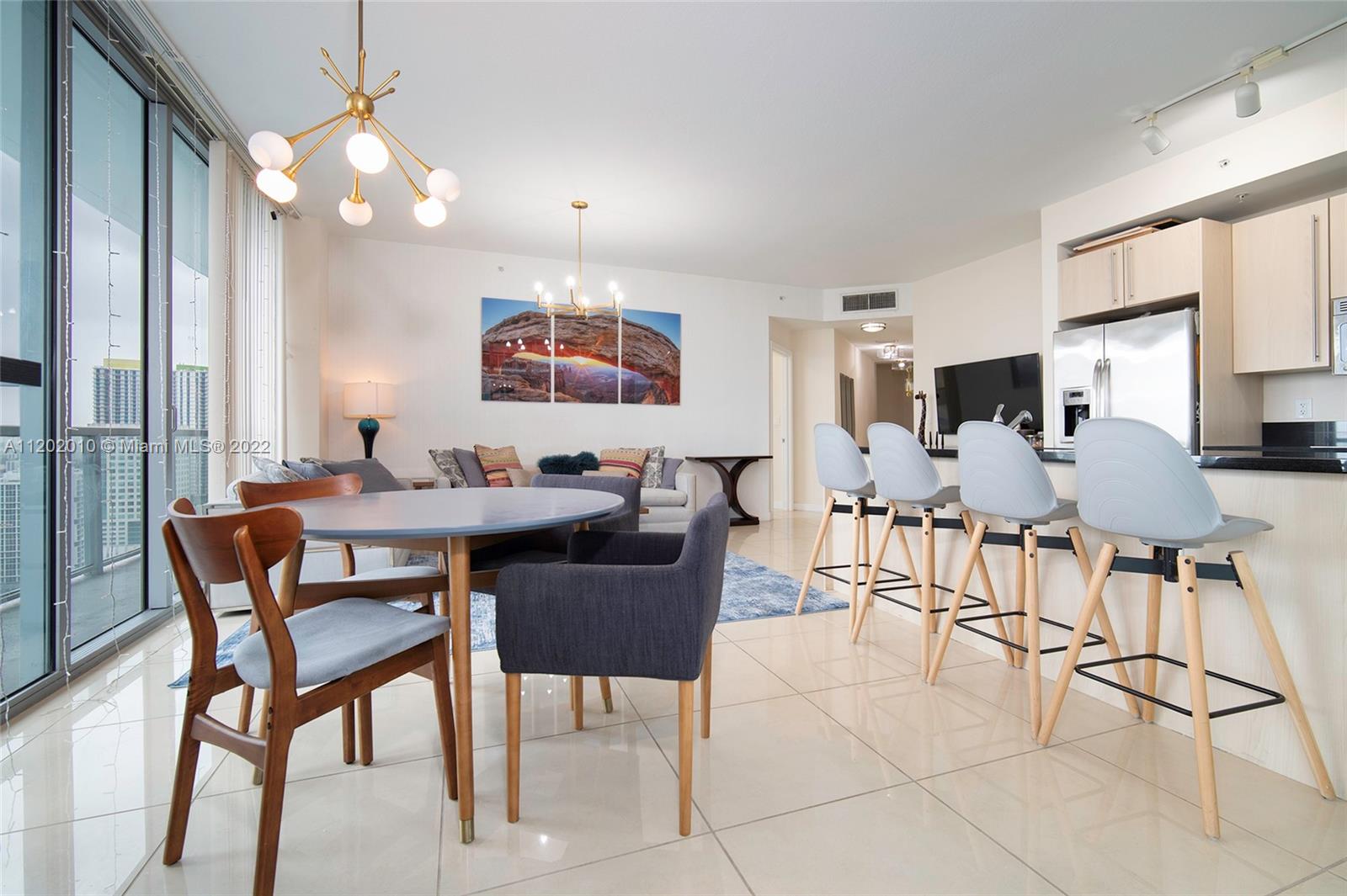 Brickell Miami, FL 33130 - Photo 6 of 30 a view of a dining room with furniture and a chandelier