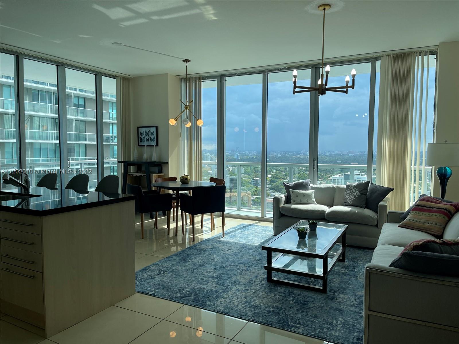 Brickell Miami, FL 33130 - Photo 9 of 30 a living room with furniture and a large window