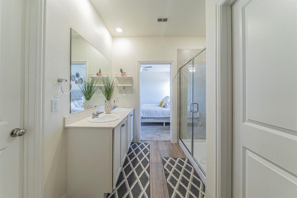 1240 Almond Road Azle, TX 76020 - Photo 13 of 26 a bathroom with a sink a toilet and shower