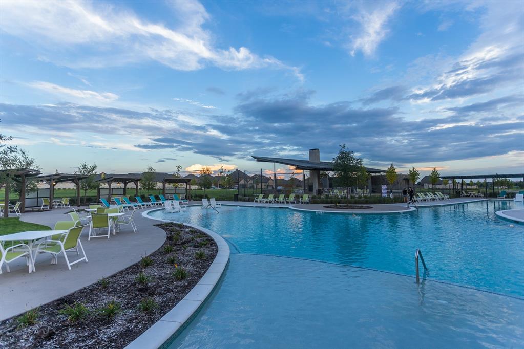 4026 Yellow Bells Way Prosper, TX 75078 - Photo 7 of 22 a view of a lake with a garden