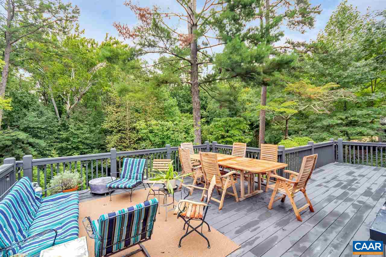 2015 Spottswood Road Charlottesville, VA 22903 - Photo 35 of 41 Private rear deck off great room is surrounded by mature trees and lush landscape. Beautiful even on a rainy day!