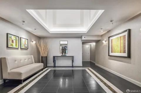 a living room with furniture and a rug