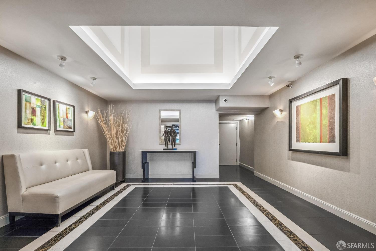 900 Green Street, Unit 600 San Francisco, CA 94133 - Photo 14 of 50 a living room with furniture and a rug