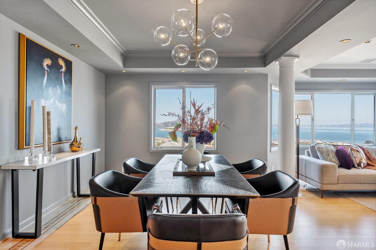 900 Green Street, Unit 600 San Francisco, CA 94133 - Photo 29 of 50 a view of a dining room with furniture a chandelier and wooden floor