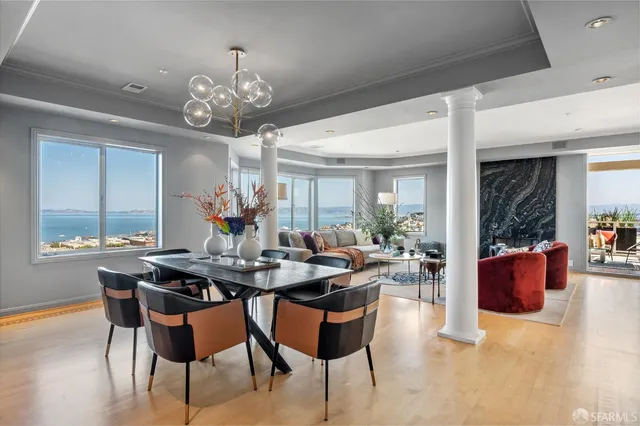 a view of a dining room with furniture window and wooden floor