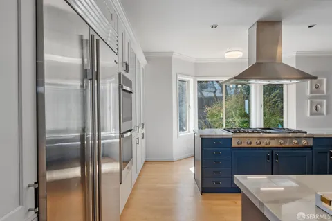 a dining table chair next to a window